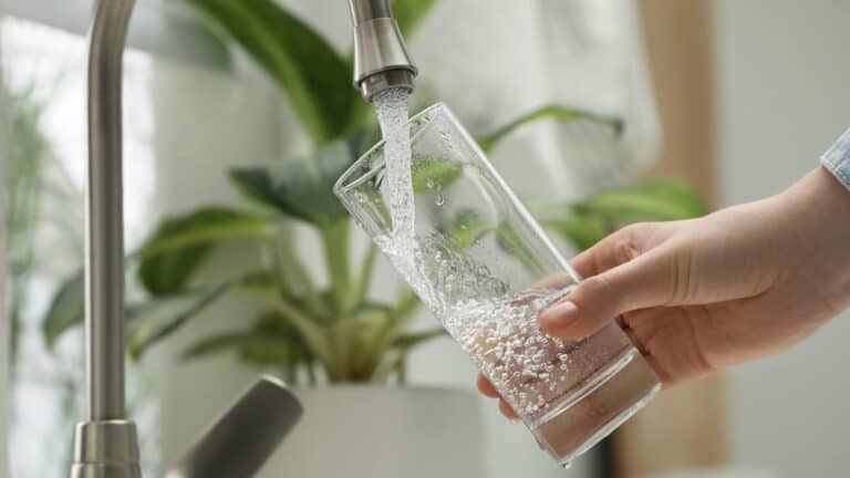 Filling glass with tap water